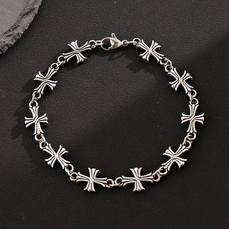 Repeating Intricate Cross Charm Bracelet