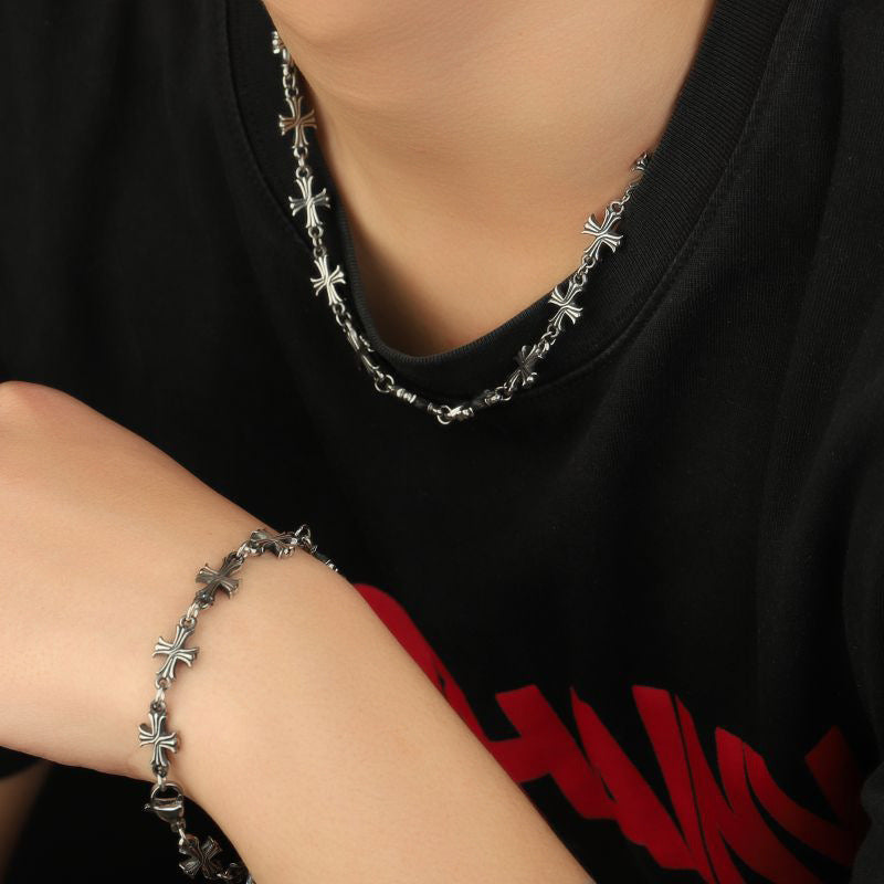 Repeating Intricate Cross Charm Bracelet